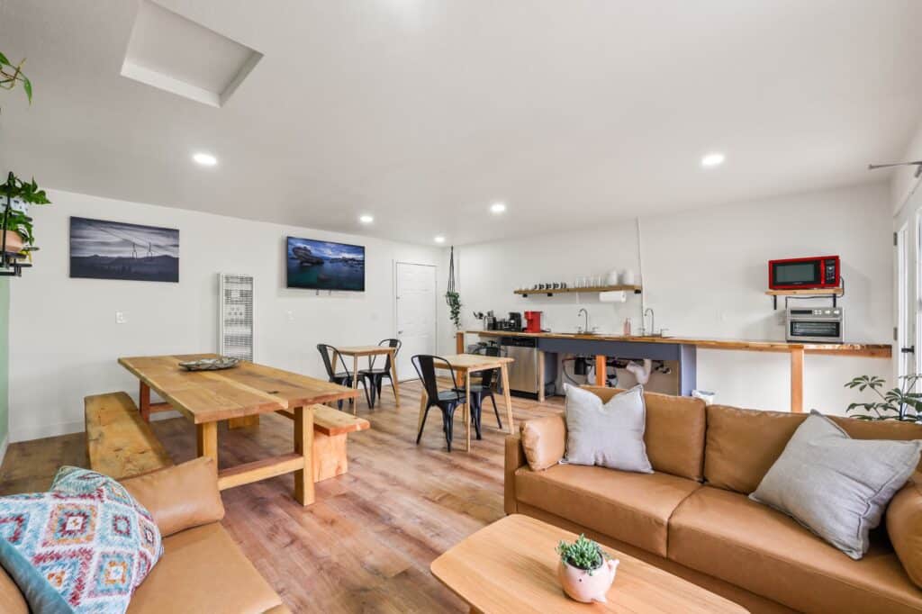 Guest common kitchen and communal dining tables at Tahoe Mountain Inn